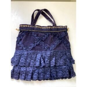 Unique purple lace purse with gold accents